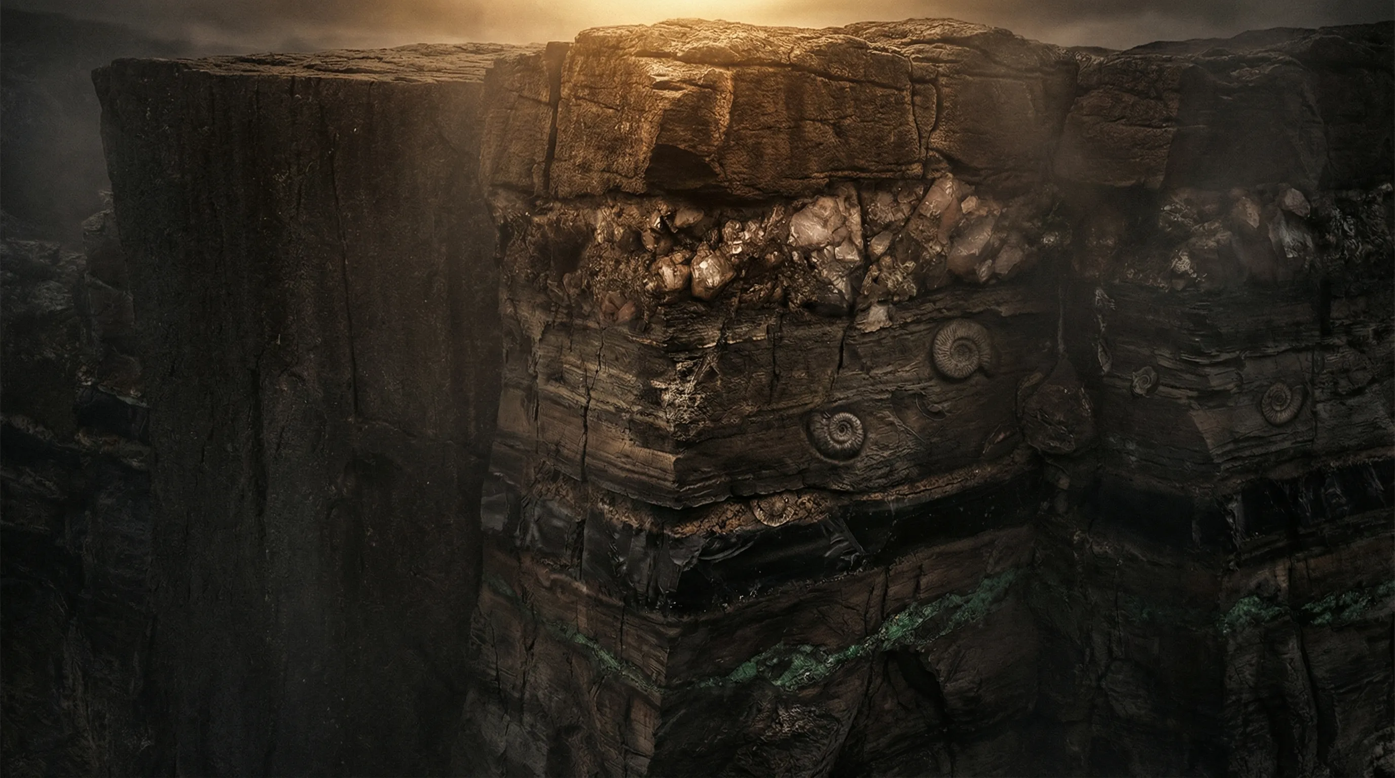 A dramatic cliff face revealing layers of geological strata — dark stone, embedded ammonite fossils, and crystalline deposits — with warm amber light catching the topmost layer